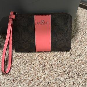 Pink and brown coach wristlet